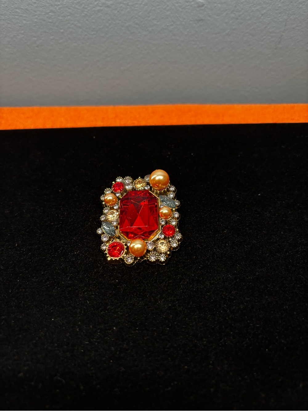 Vintage-Inspired Red Crystal Brooch with Gold and Pearl Accents